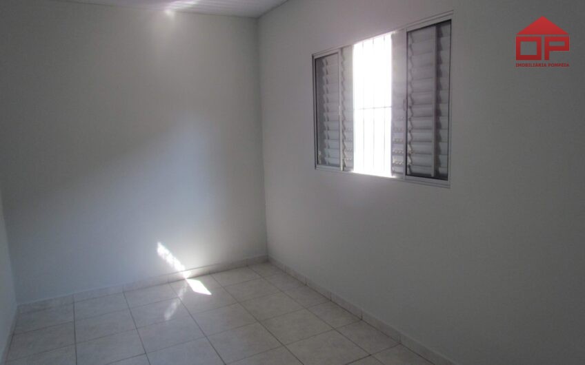 Casa com edícula
